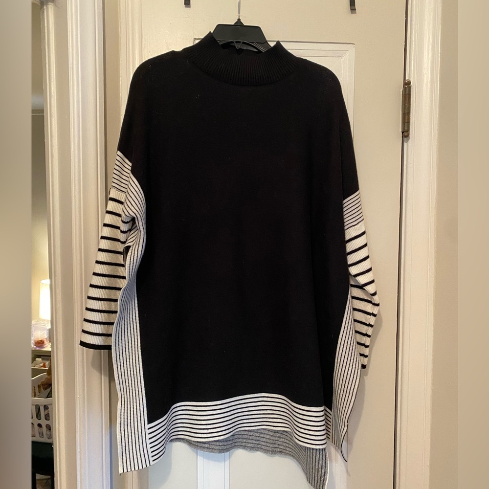 Cape cut sweater.
